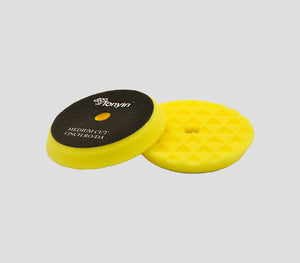 Medium-cut beveled triangle foam pad with hole for spot removal by Rocket Science Alliance, designed for effective surface cleaning.