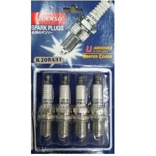 Set of four DENSO Copper K20R-U11 spark plugs, automotive ignition parts with metal and ceramic components.