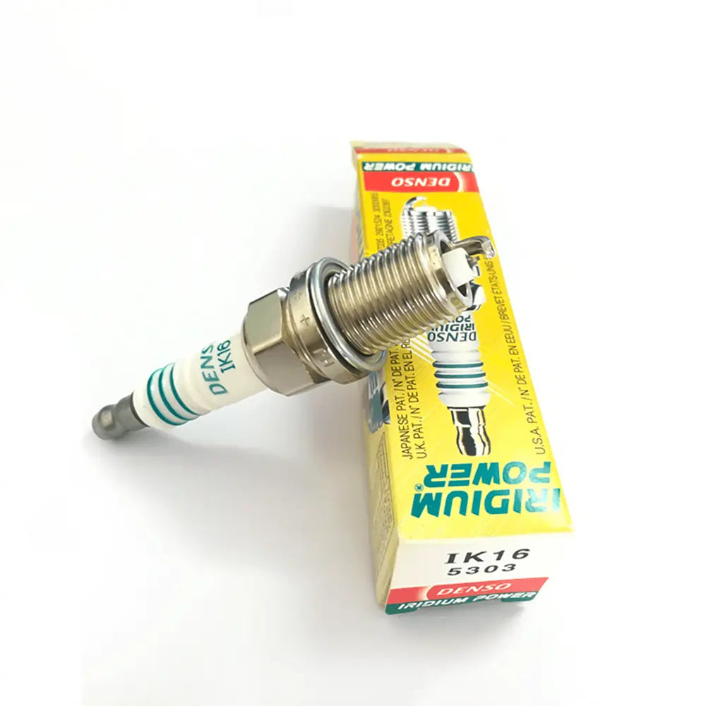 Set of four DENSO Iridium Power IK16 spark plugs showing the metallic tips and black ceramic insulators.