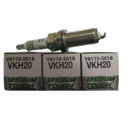 Set of four DENSO Iridium Tough VKH20 spark plugs, durable automotive ignition components for reliable engine performance.