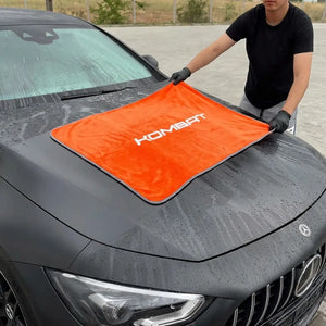 KOMBAT Ultra Thick Microfiber Car Drying Towel 36x24 inches, 850 GSM, shown drying a car without scratches or water spots