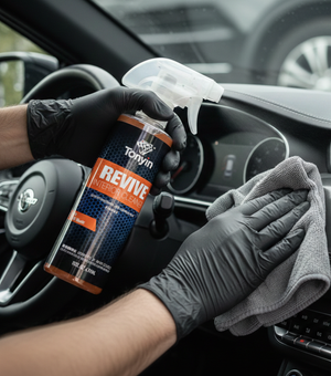 Rocket Science Alliance Revive Interior Cleaner 500ml spot remover for leather, plastic, and vinyl, showing the cleaning in progress.